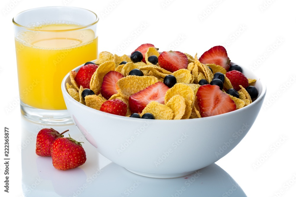 Bowl of Cornflakes, Blueberries, Strawberries and Orange Juice