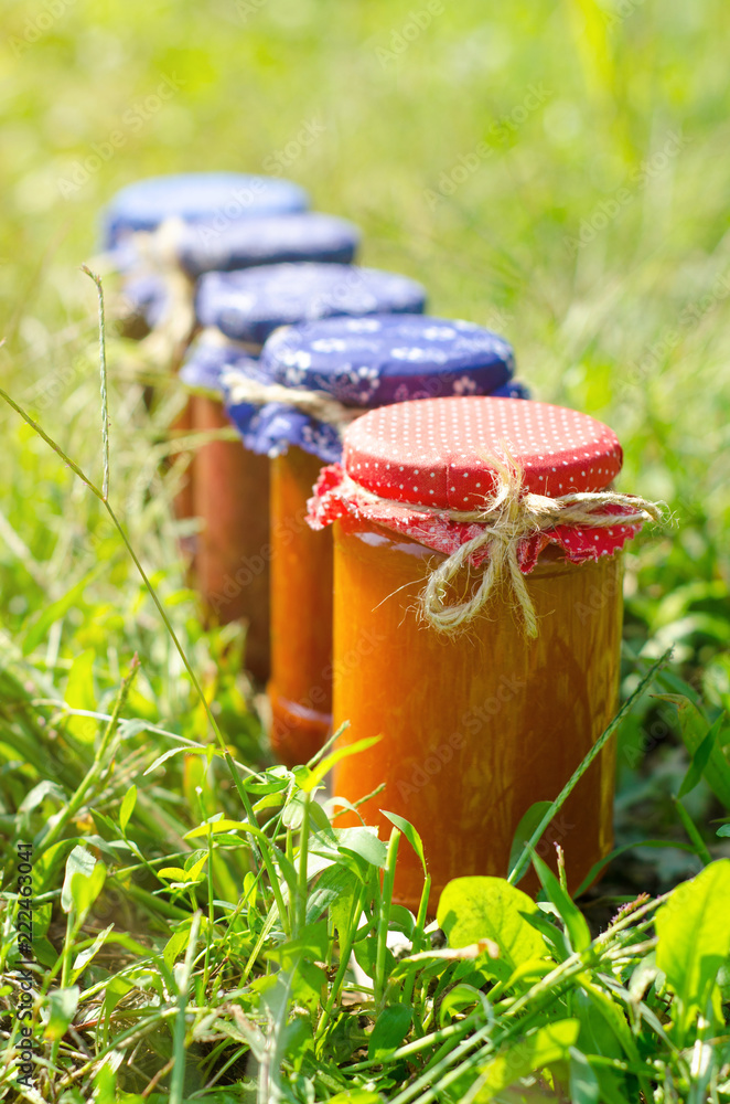 Glass jars with different kinds of jam