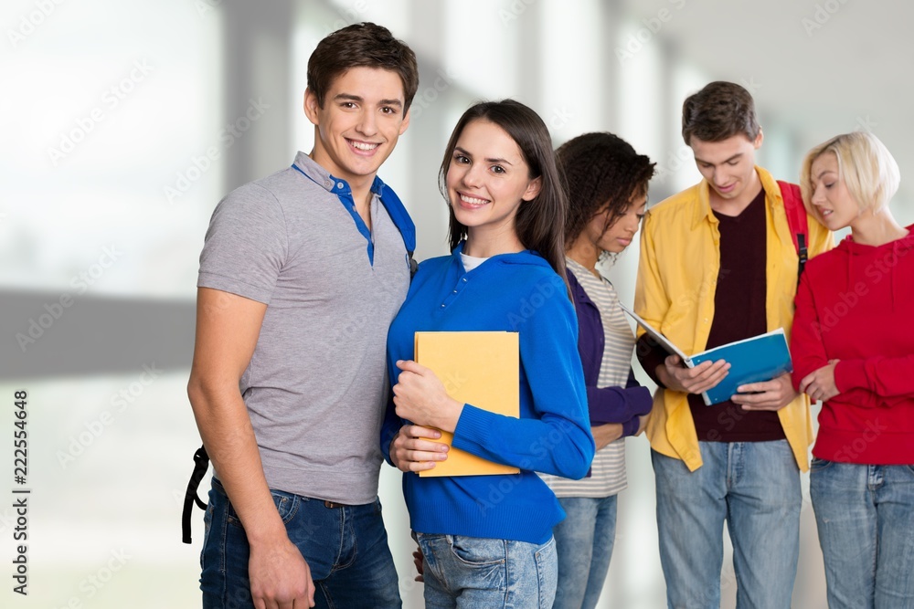 Group of students with books on background