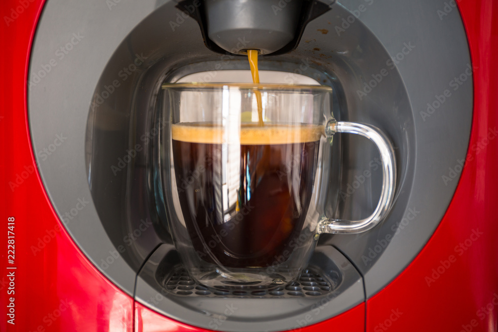 Automatic machine preparing cup of coffee