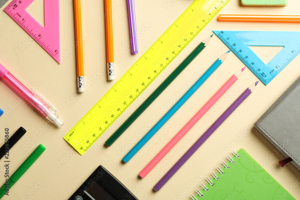 Composition with different school stationery on color background