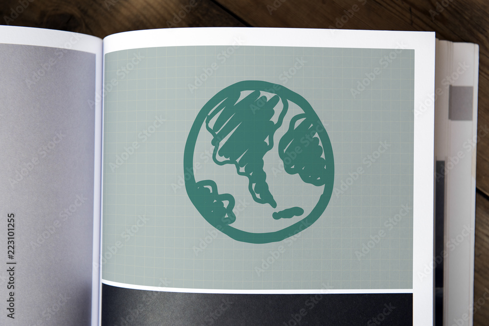 Green globe drawing on a magazine