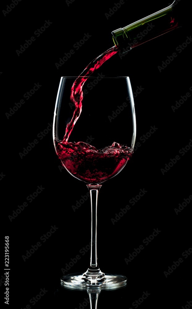 Pouring Red Wine into a Glass