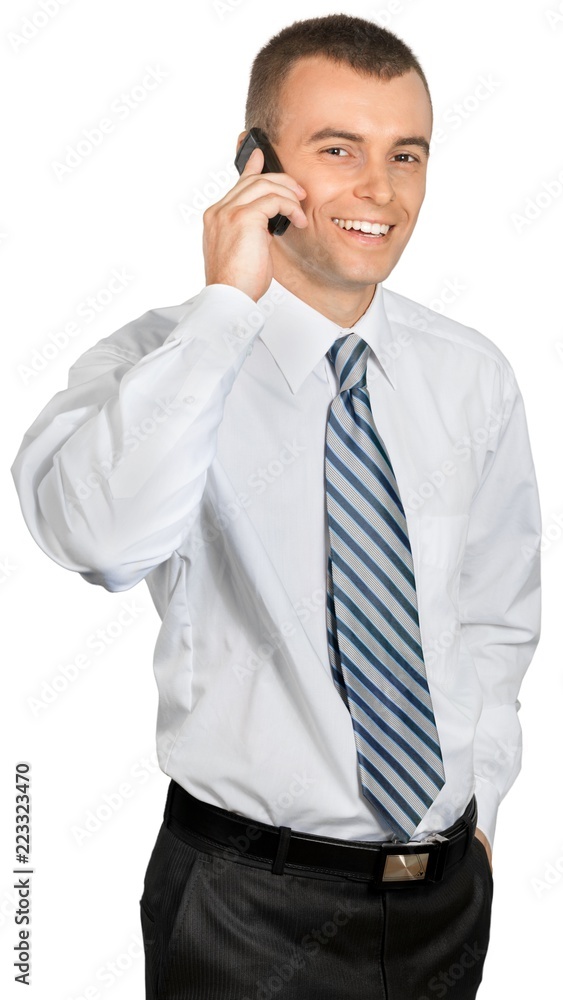 Businessman Talking on the Phone with Hand in Pocket - Isolated