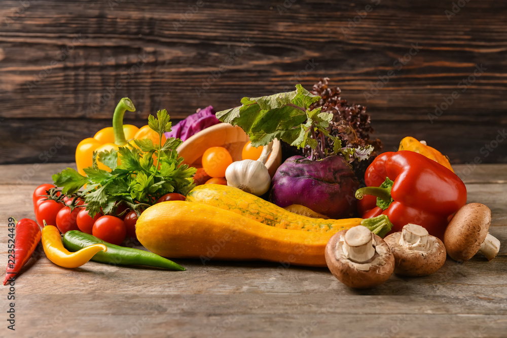 Various fresh vegetables on wooden table