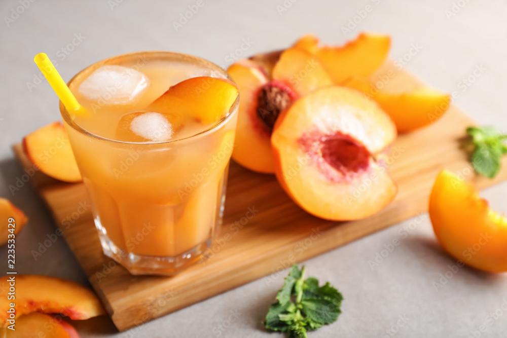 Fresh summer cocktail in glass on wooden board