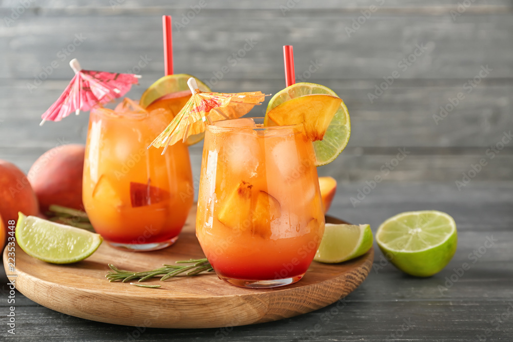 Fresh summer cocktail in glasses on wooden board