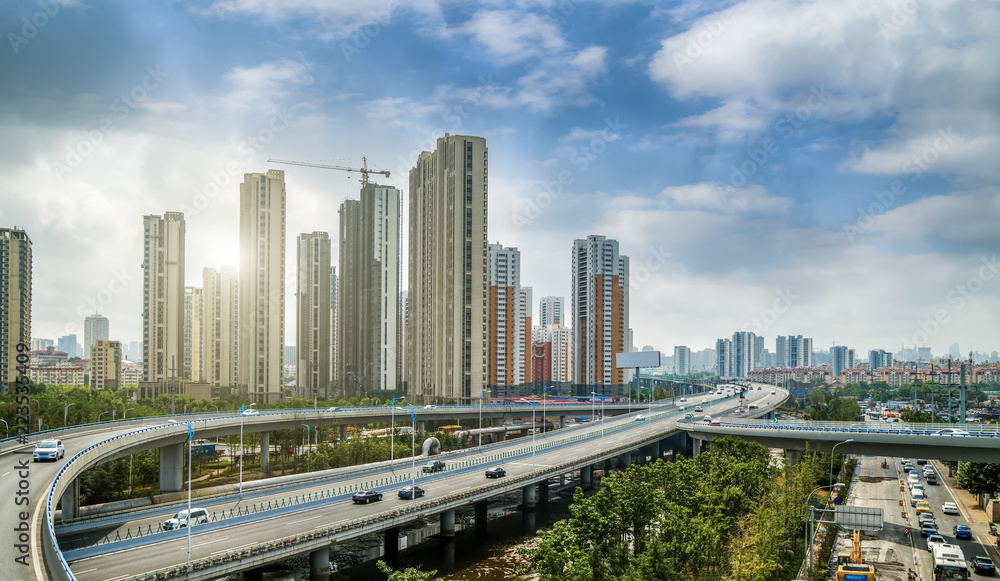 Road pavement and city building skyscrapers