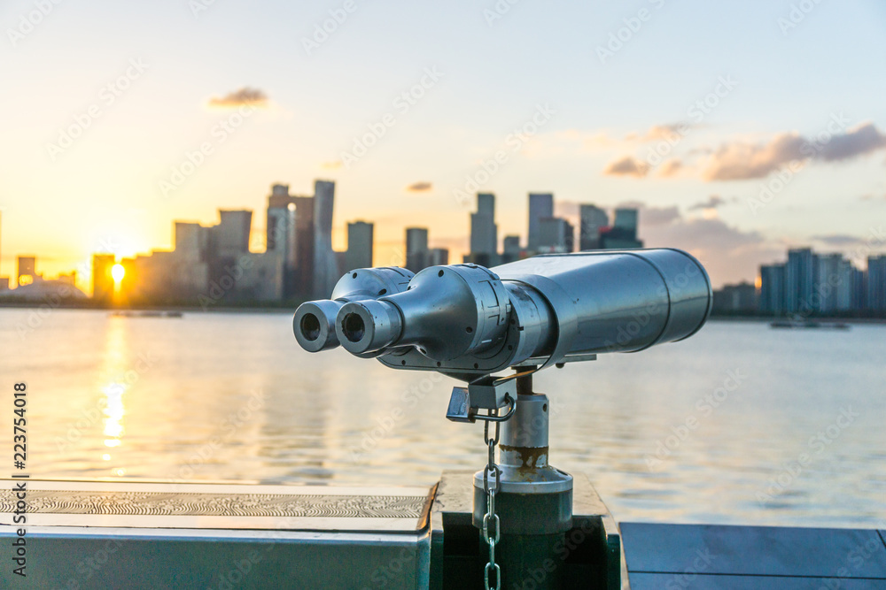 telescope with city skyline in hangzhou china