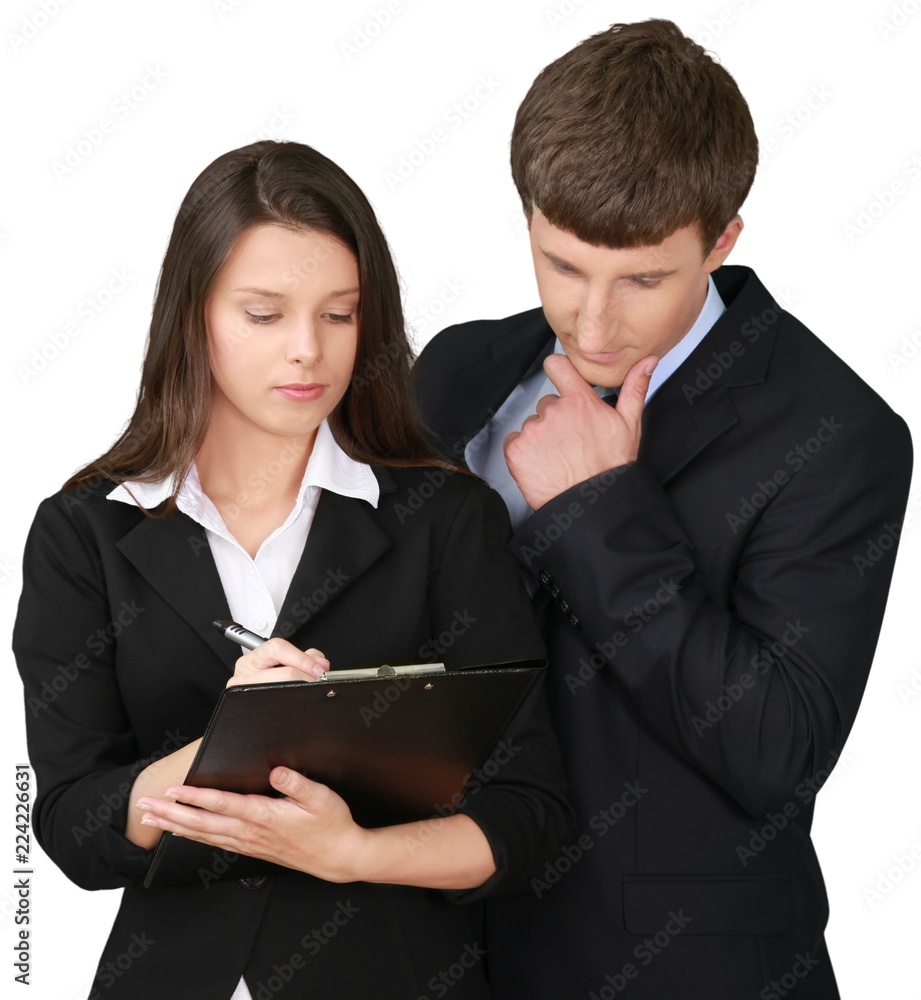 Businessman Stroking Chin and Businesswoman Sign Document -