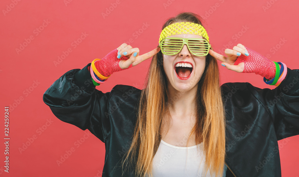 Woman in 1980s fashion theme on a pink background