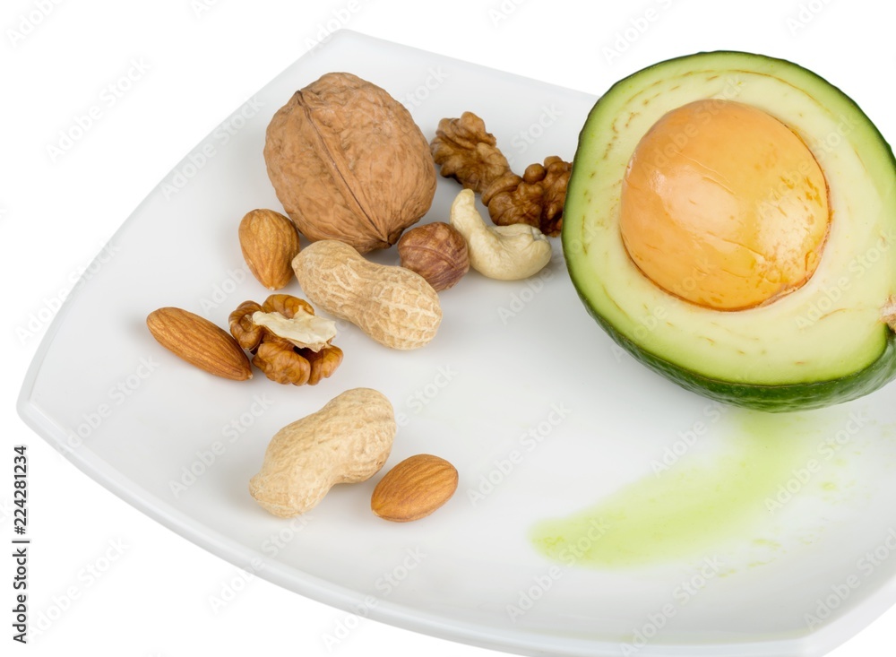 Nuts and sliced avocado on a plate