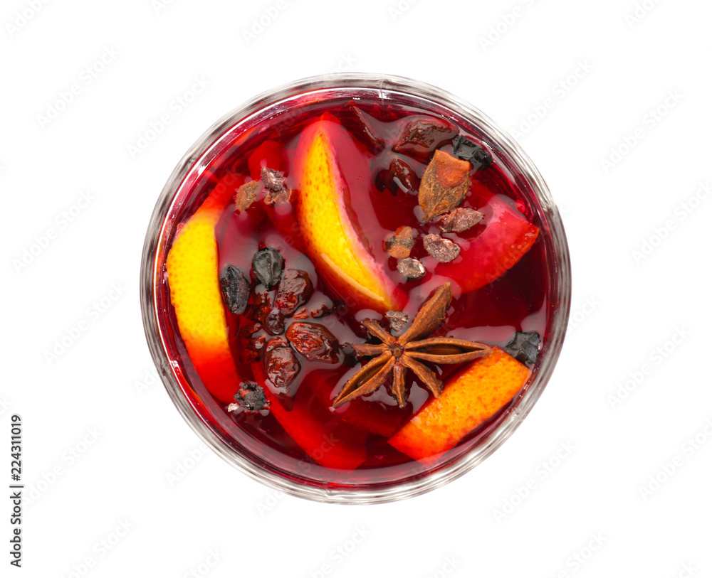 Glass of delicious mulled wine on white background