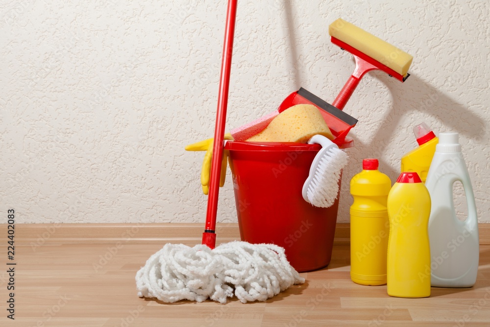 House Cleaning Equipment and Supplies in Bucket on the Floor