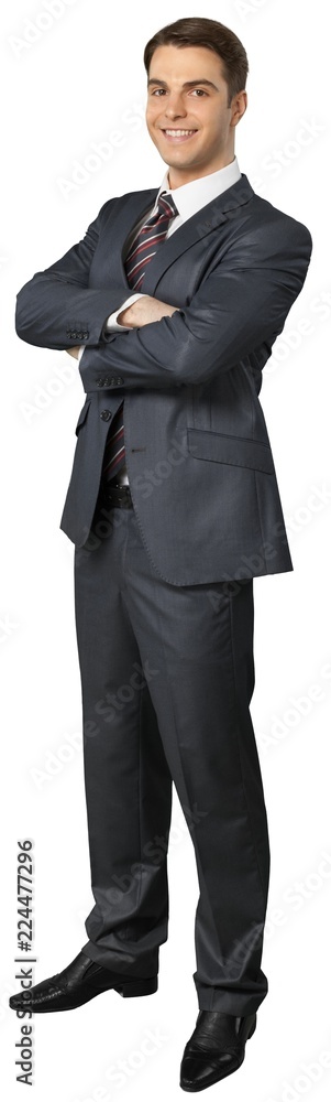 Friendly Businessman Standing with Arms Folded - Isolated