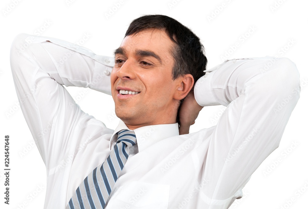 Calm Businessman Sitting with Hands Behind Head - Isolated