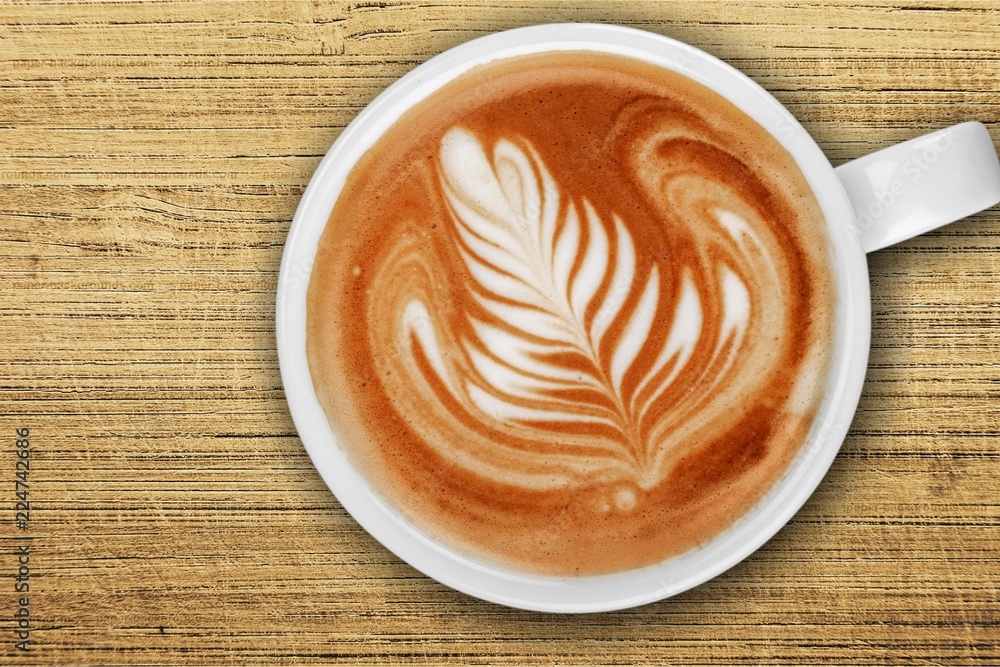 Cup of tasty cappuccino, top view