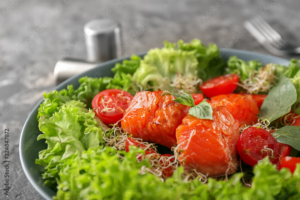 Healthy fresh salad with salmon on plate