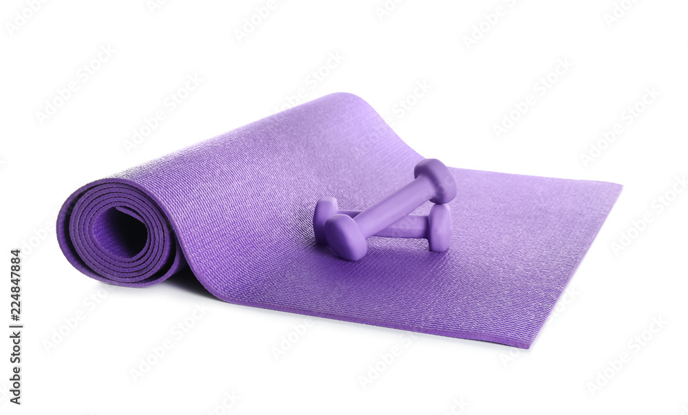 Color yoga mat with dumbbells on white background