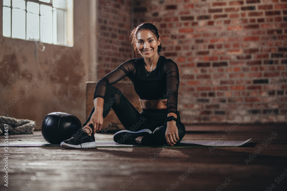 Woman during a break in the gym