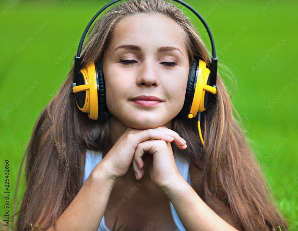 Portrait of a Young Woman Listening to Music