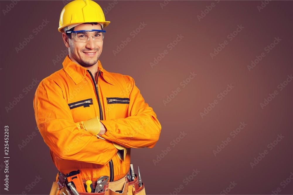 Male worker in hardhat smiling at camera