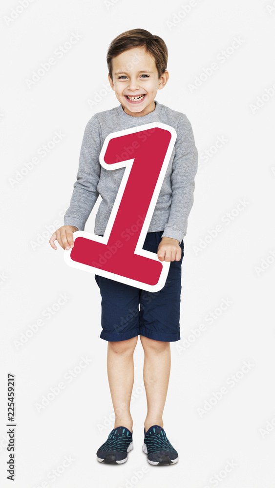 Happy kid holding number one