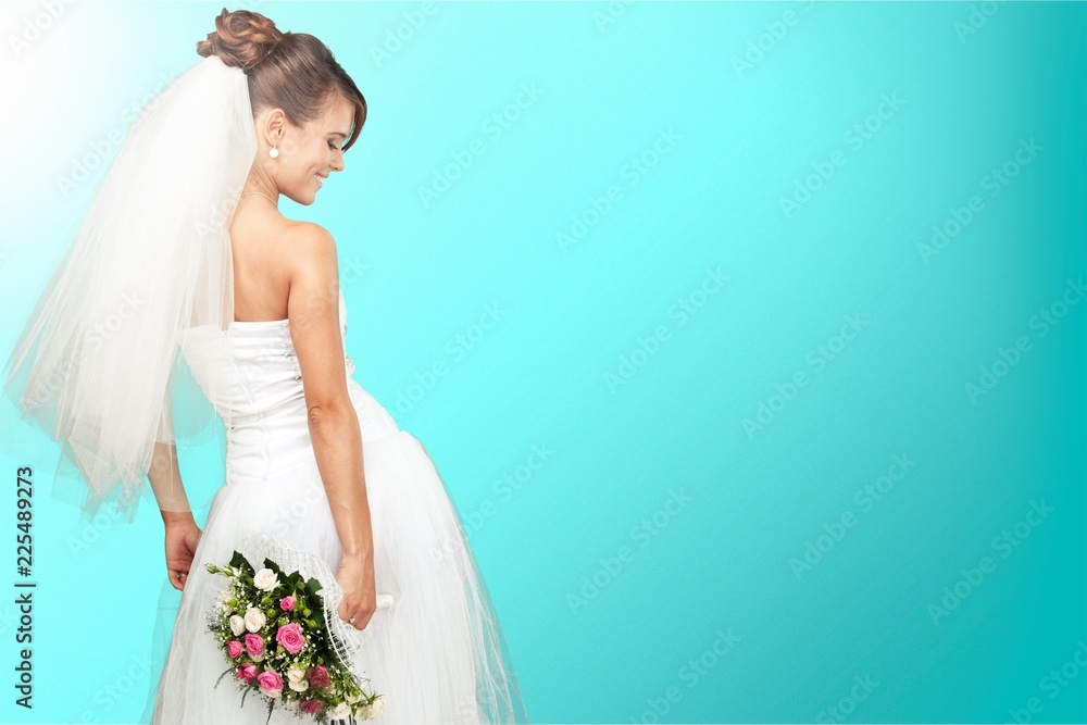 Beautiful Brunette Bride holding Wedding Bouquet