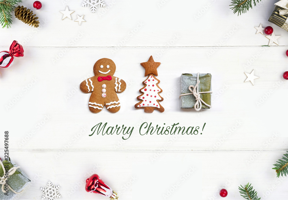 Christmas card. Creative composition concept with cookie gingerbread men, Christmas tree and gift on