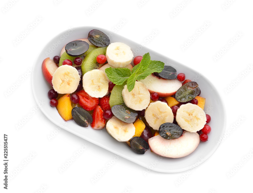 Plate with delicious fruit salad on white background