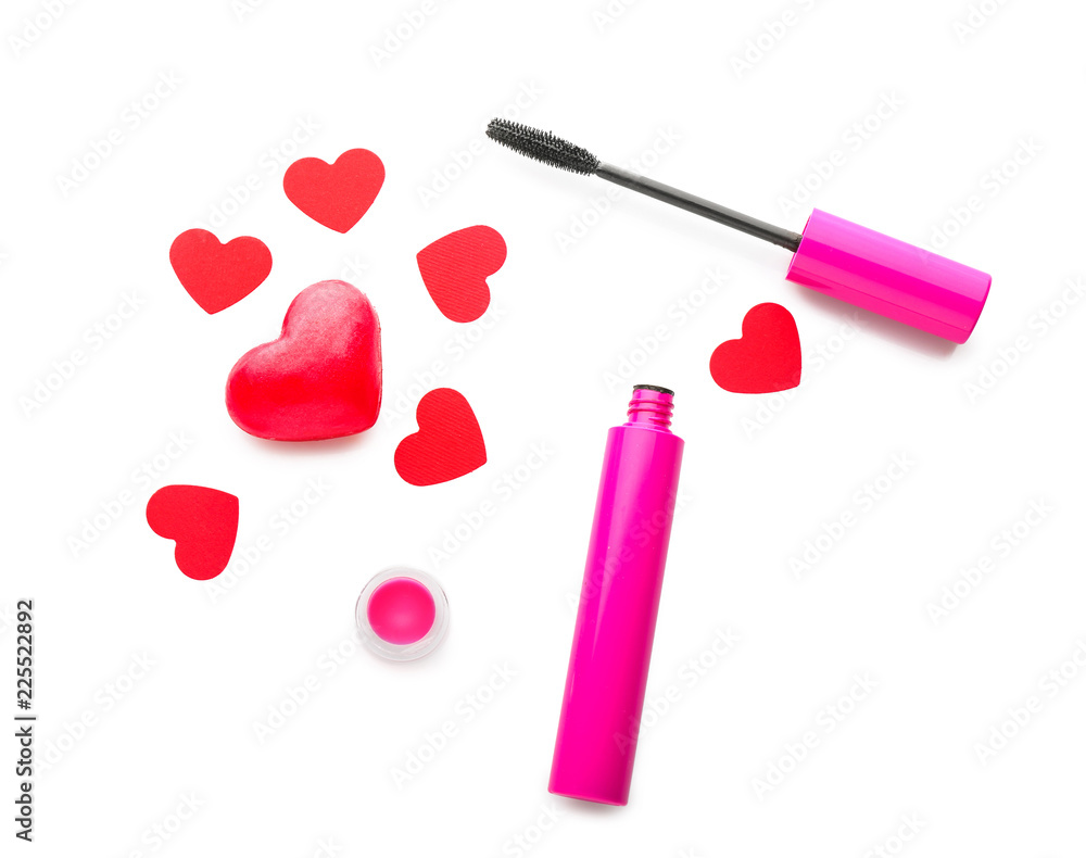 Mascara with red hearts on white background