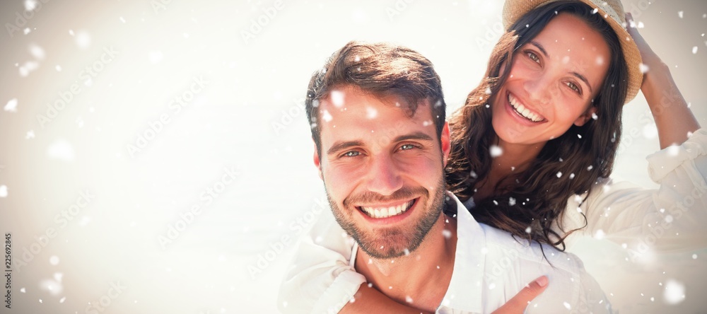 Composite image of man doing piggy-back to girlfriend 