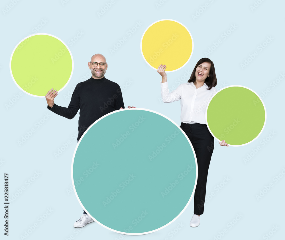 Cheerful people holding empty round boards