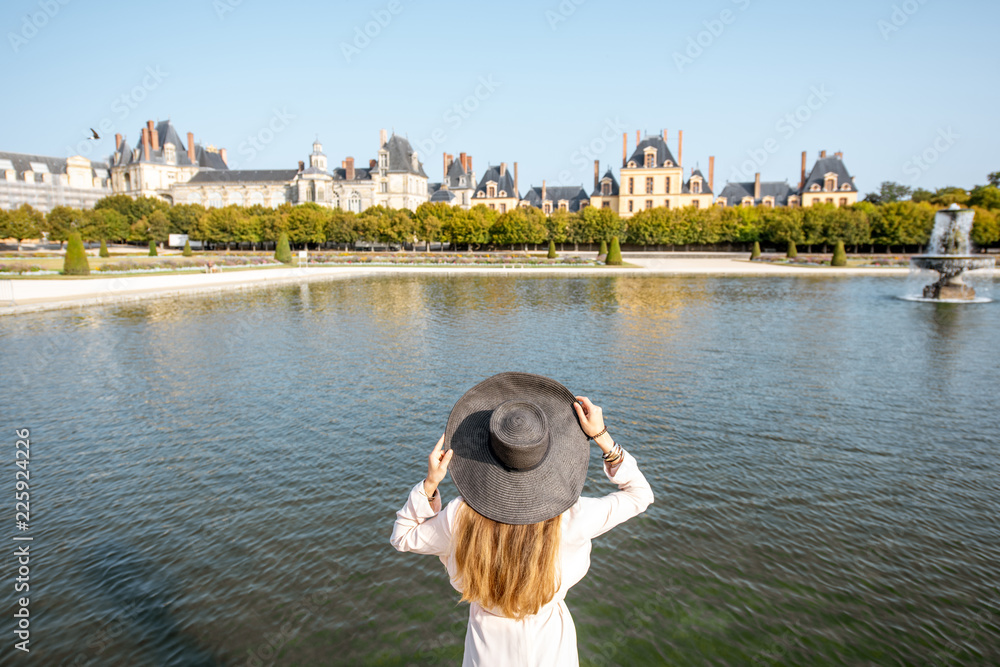 Woman in Fontainebleau gardens, France