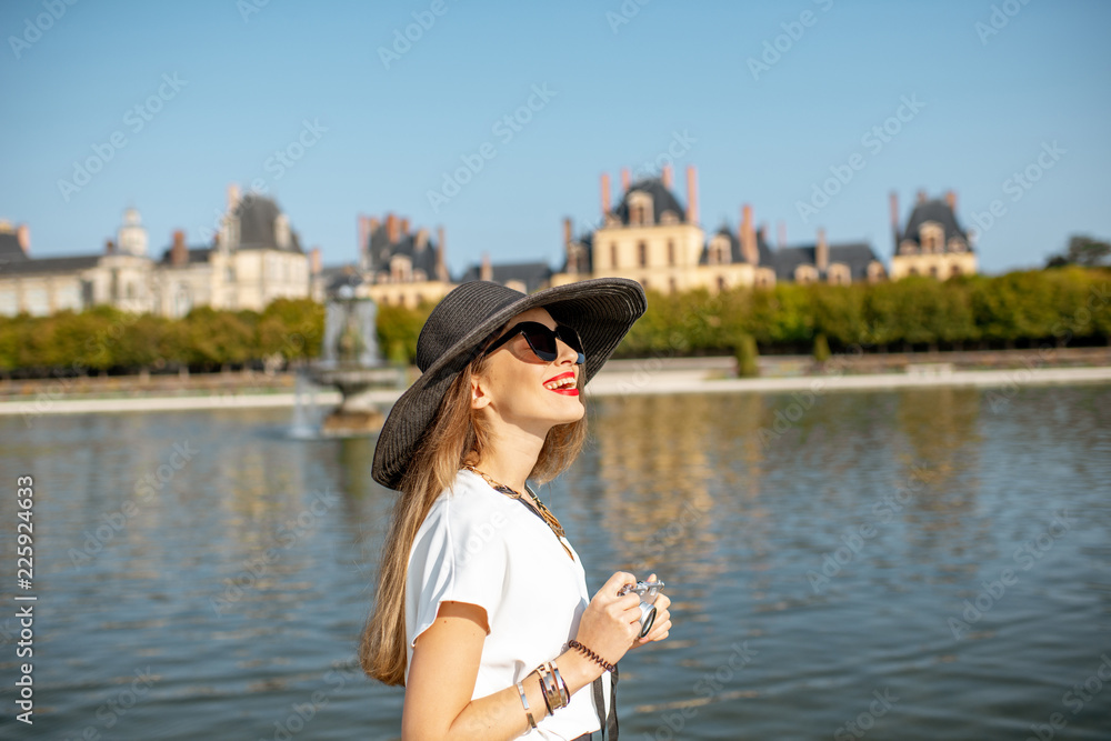 Woman visiting Fontainebleau gardens, France