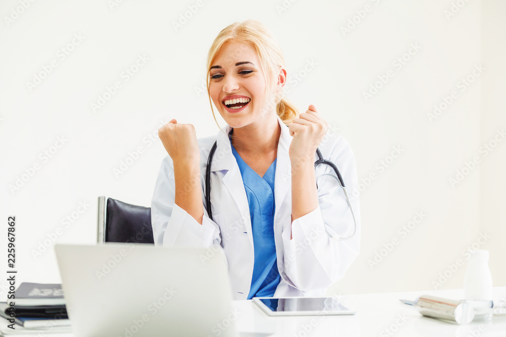 Happy doctor in hospital. Medical success concept.