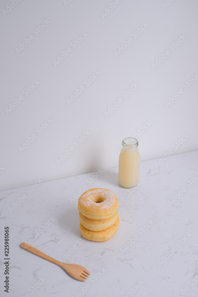 Classic donut. Morning breakfast on table in living room at home.