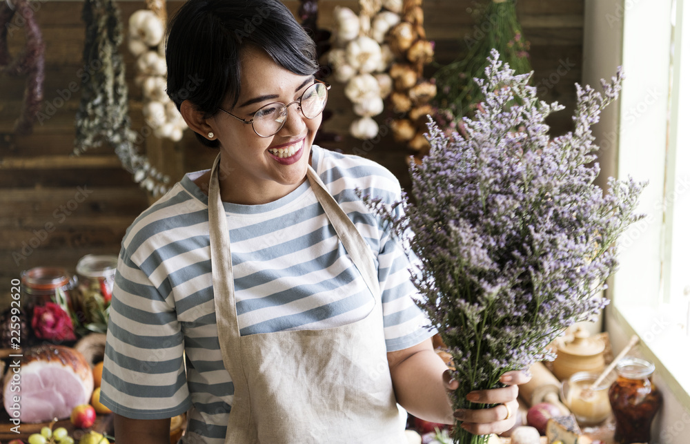 Florist holding a bouquet of caspia flowers