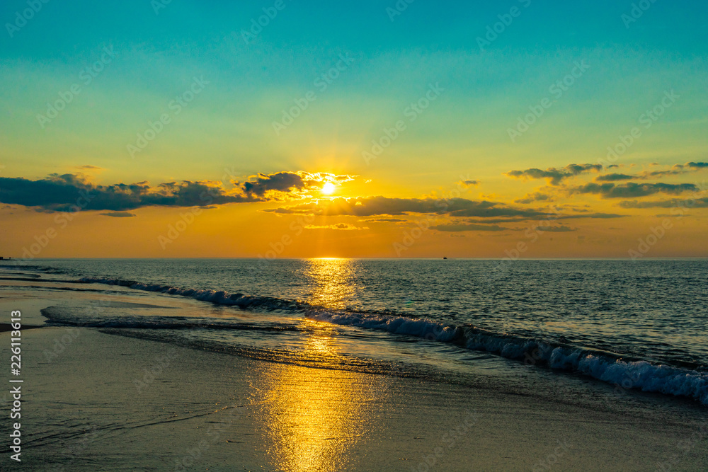 Sunset on the beach on north side of the Provincelands Cape Cod, Atlantic ocean view MA US.