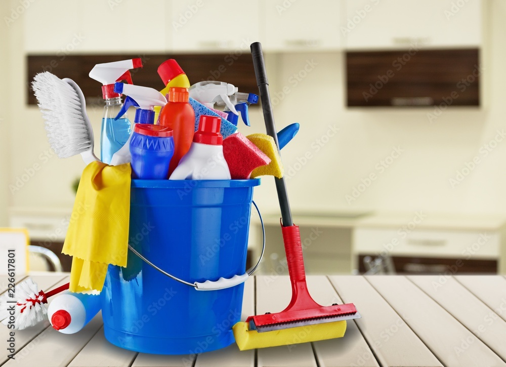 Plastic bottles, cleaning sponges and gloves on