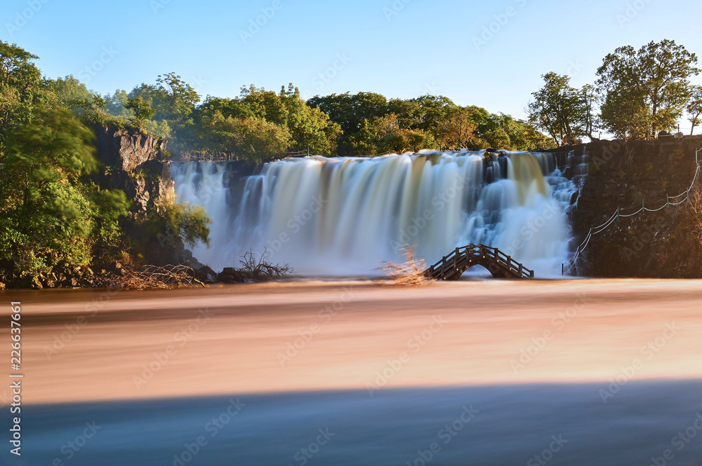 Ching-po Lake waterfalls of China sunset landscape.