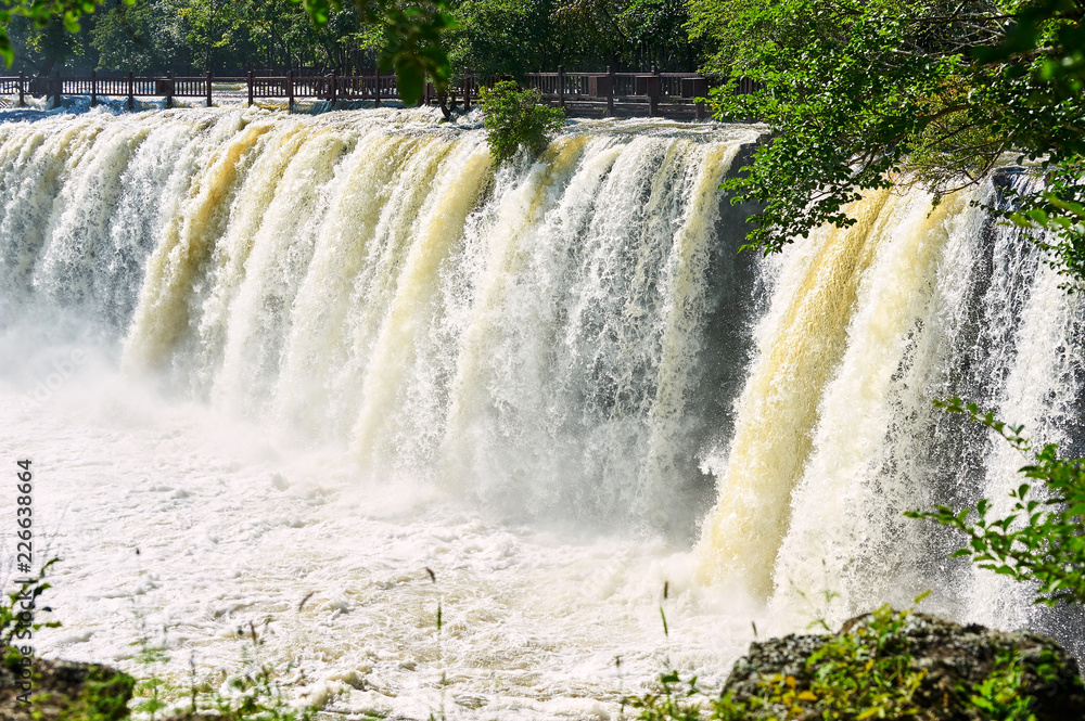 Ching-po Lake waterfalls of China sunset landscape.