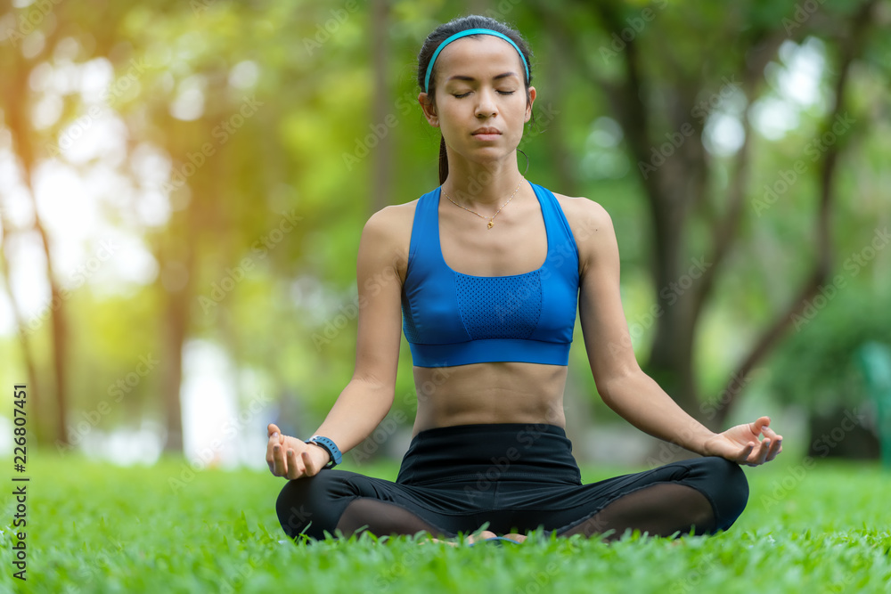 Healthy Lifestyle. Meditation mind yoga woman for relax vital and energy in the park.  Healthy Conce