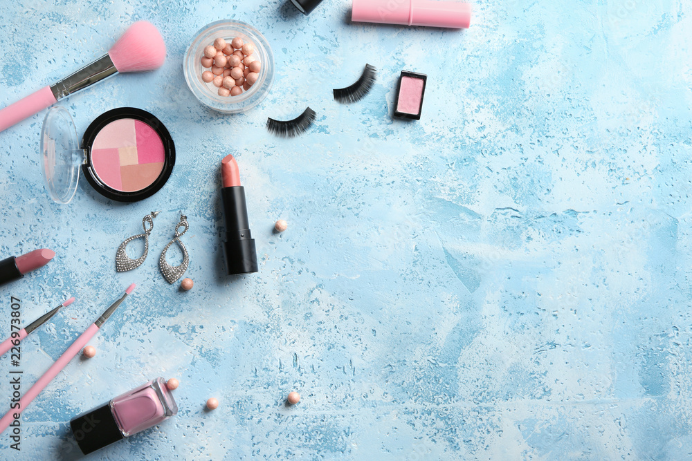 Flat lay composition with decorative cosmetics on color background