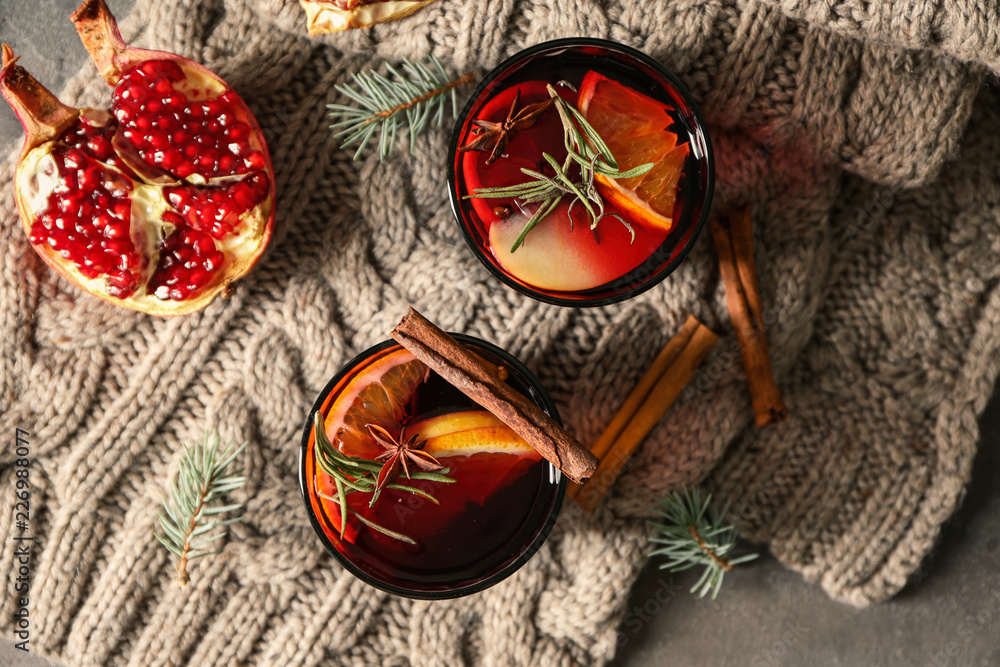 Glasses of delicious mulled wine on warm plaid