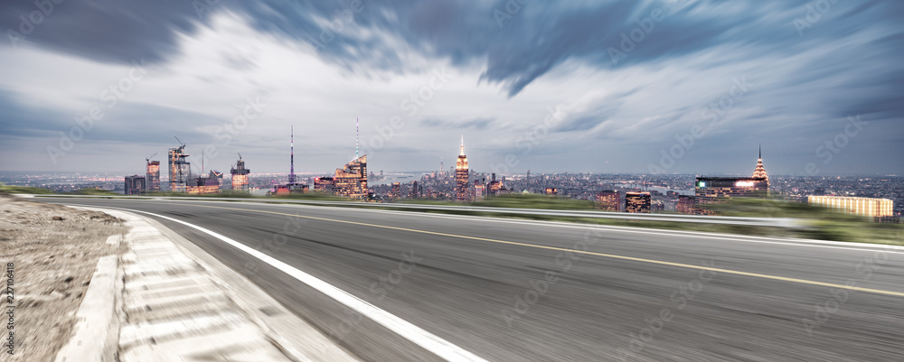 empty asphalt highway with modern cityscape new york