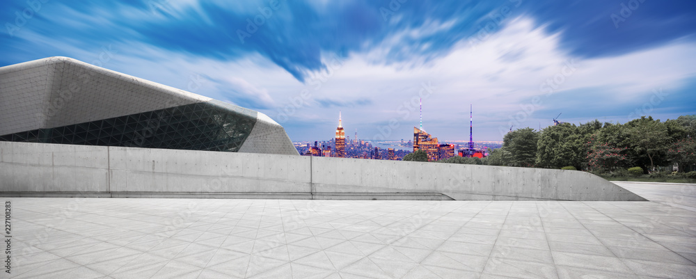 empty ground with modern cityscape new york at night