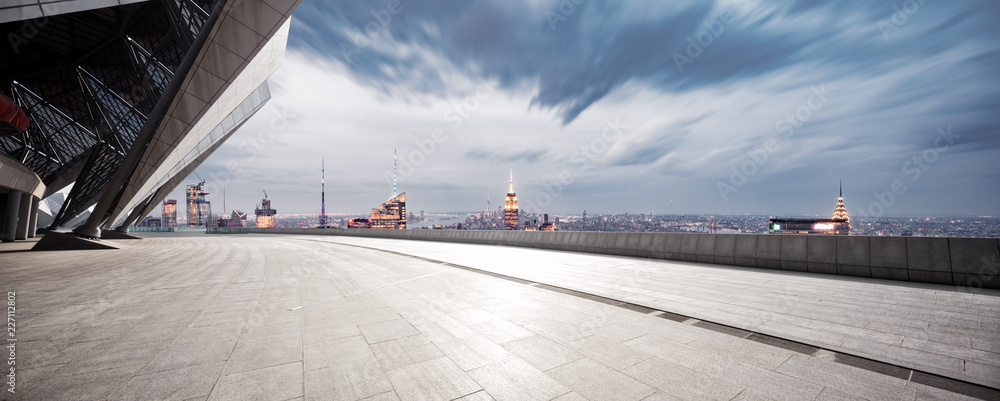 empty ground with modern cityscape new york at night