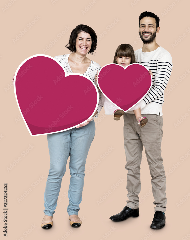 Happy family holding heart icons