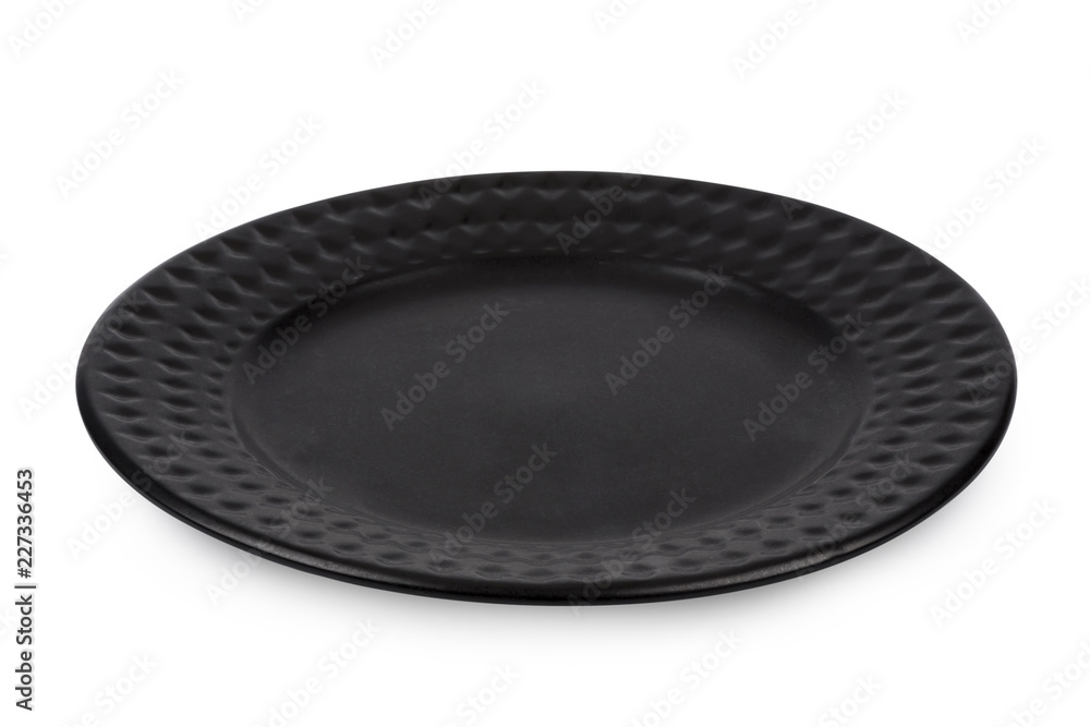 Black dinner plate isolated on white background.